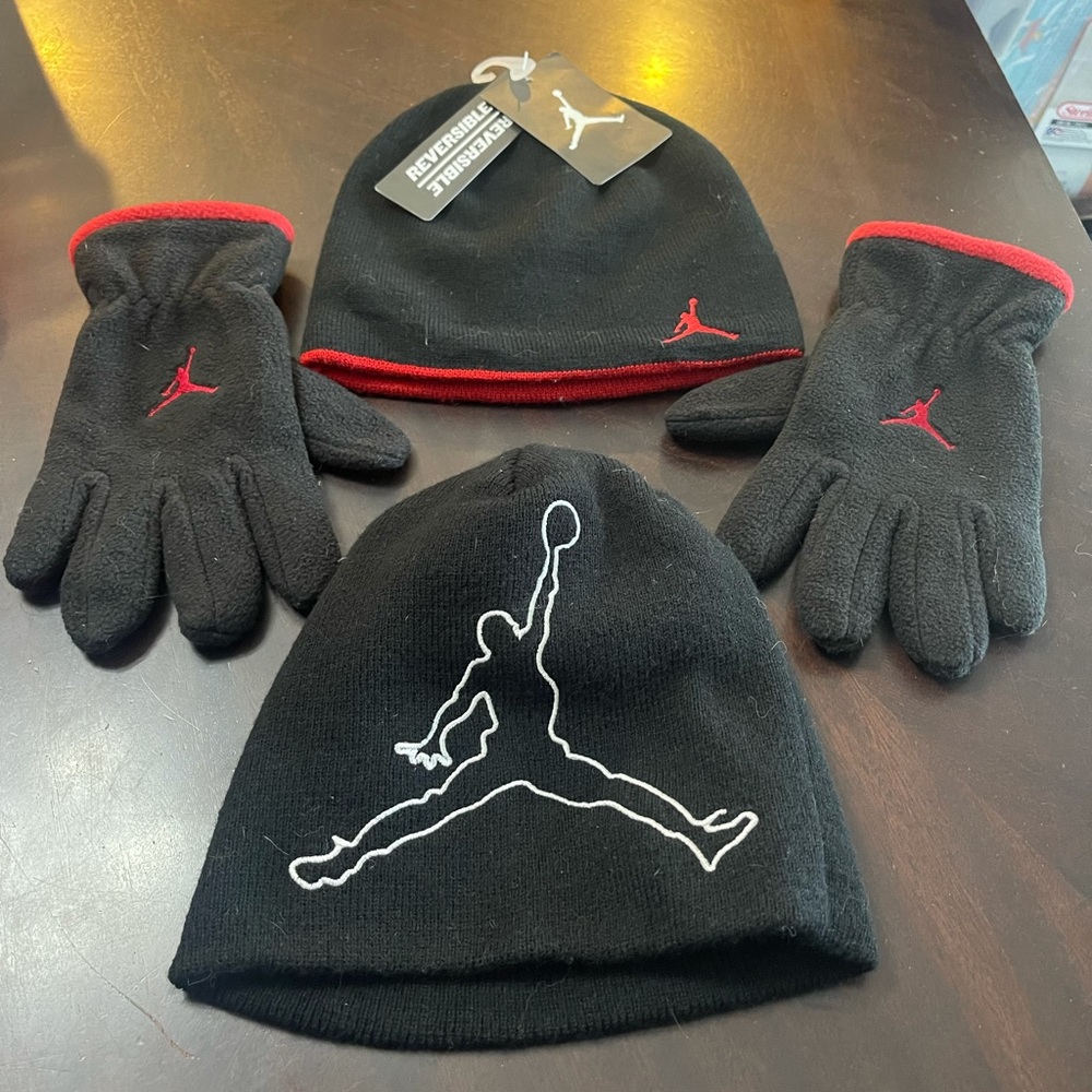 Air Jordan youth beanies (2) and a pair of gloves.
